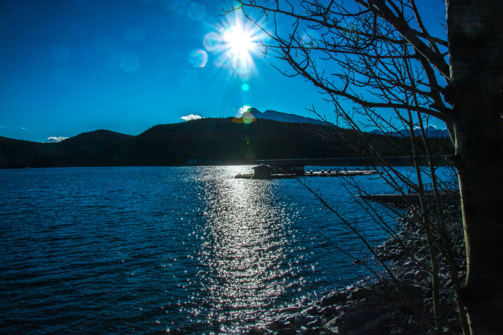 Sun over Mount Inglesmaldie and Lake Minnewanka