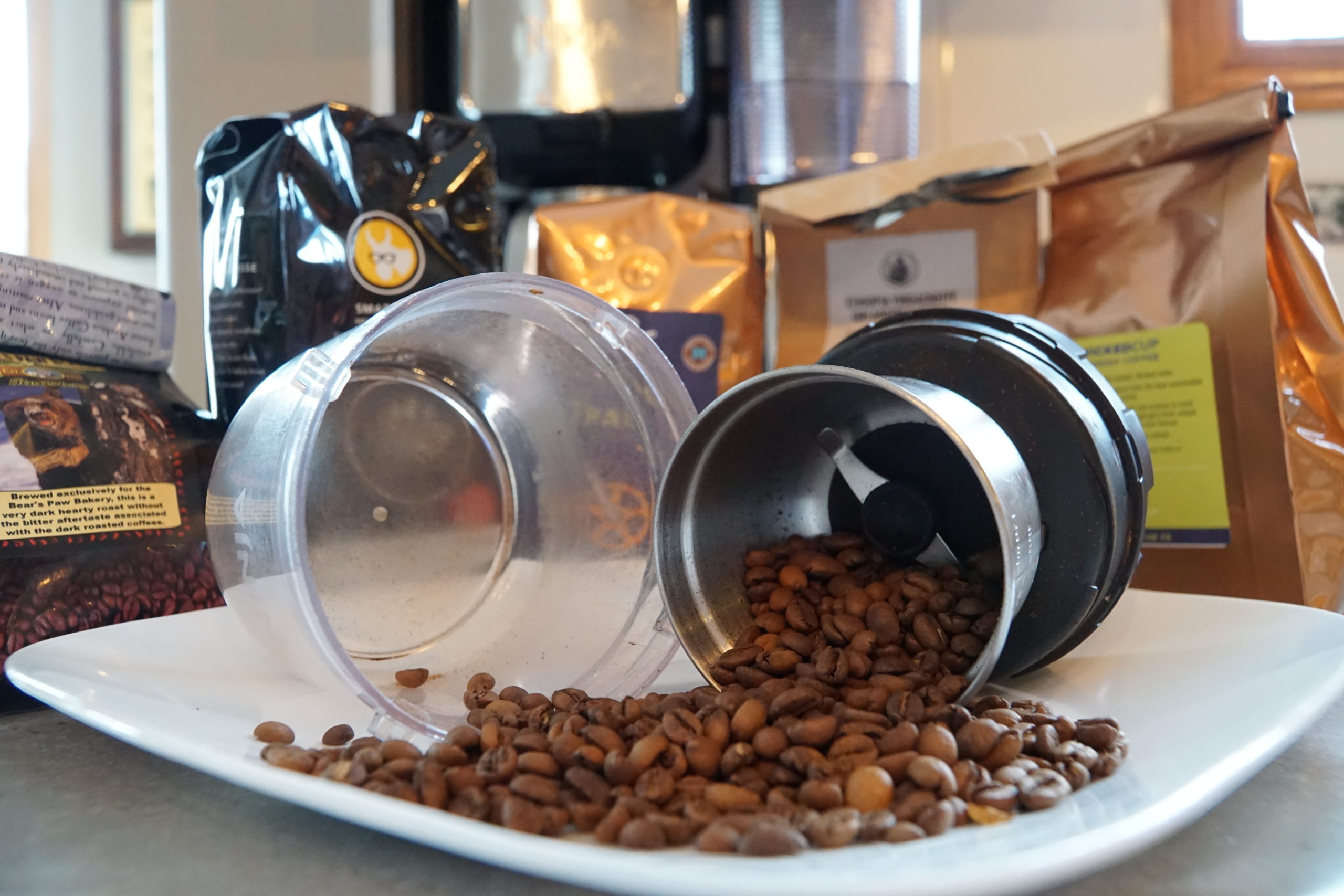 Coffee from a coffee grinder tipped and spread out on a plate